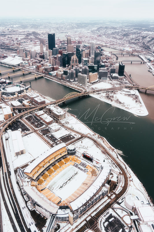 Aerial View of Heinz Field (Acrisure Stadium), PNC Park, and Downtown Pittsburgh in Snow
