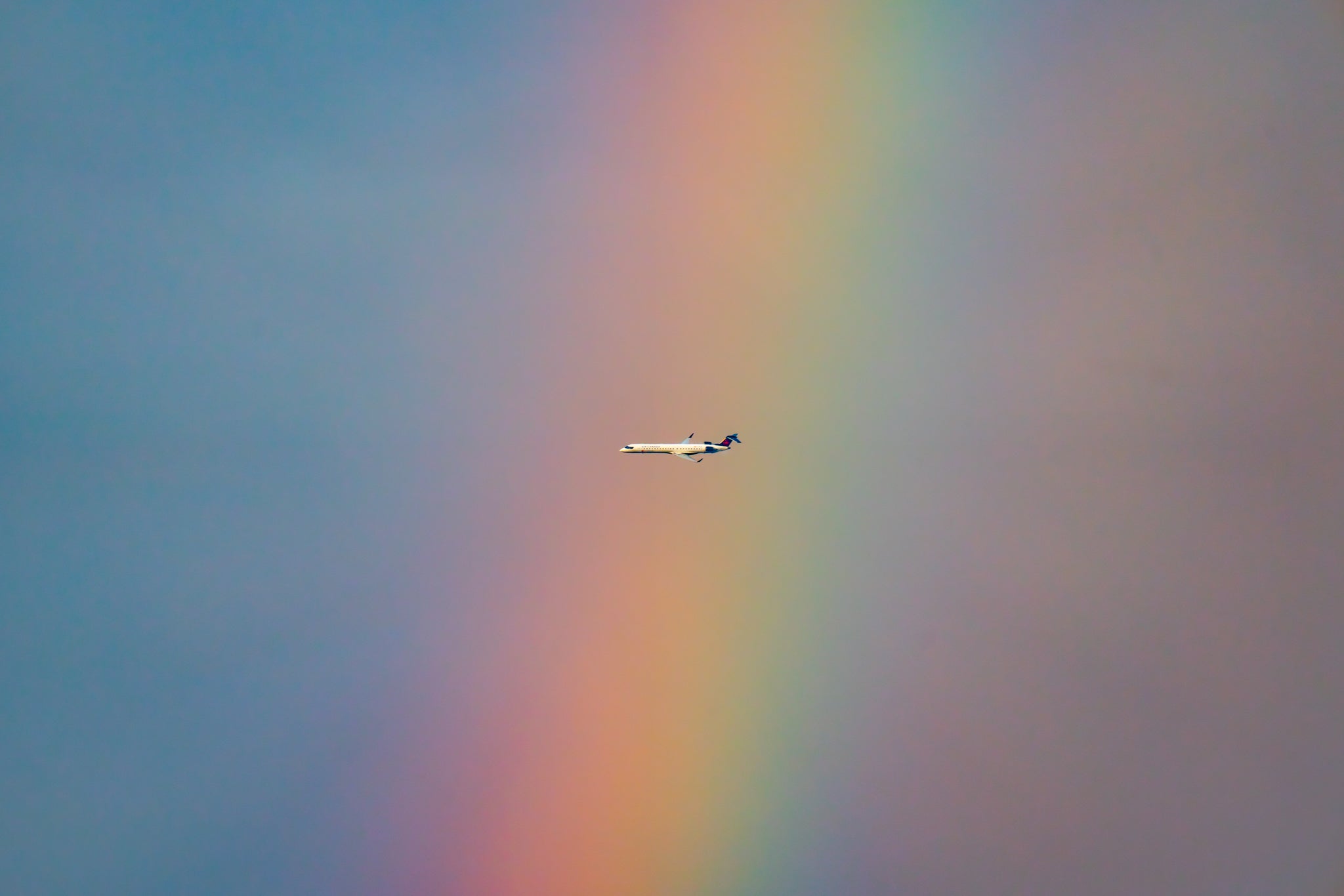 Air Canada Flight Flies by a Rainbow