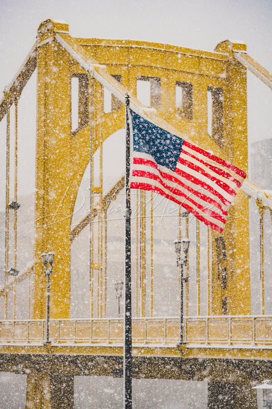 American Flag and Clemente Bridge in the Snow
