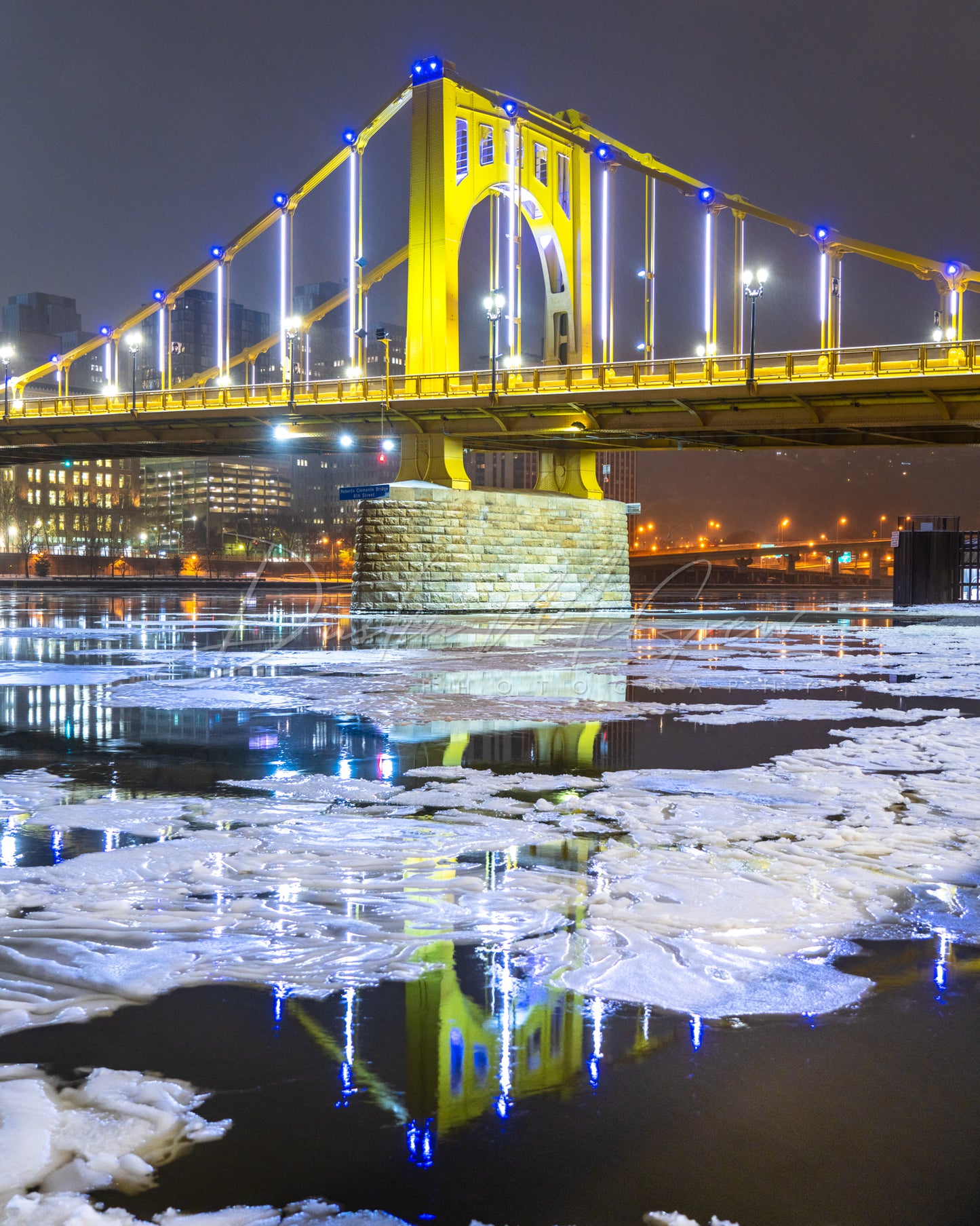 Clemente Bridge Reflecting in the Frozen Allegheny River