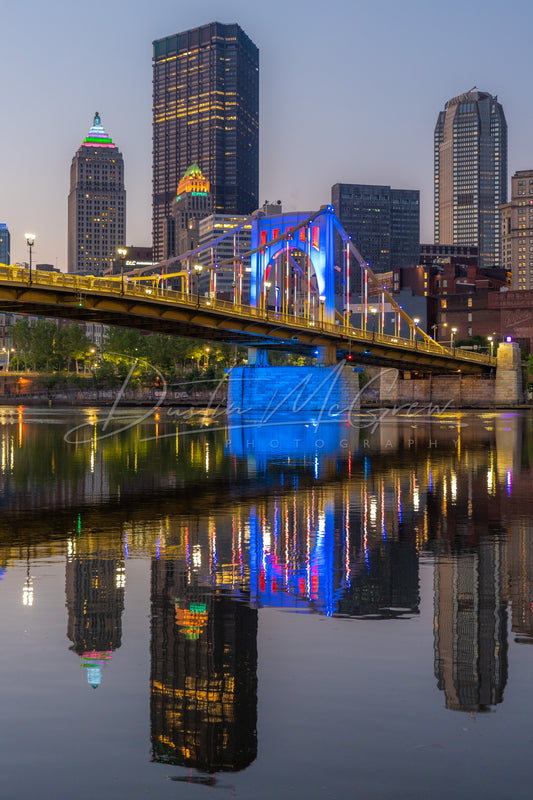 Photo of the Warhol Bridge in Red White and Blue and the Pittsburgh Skyline