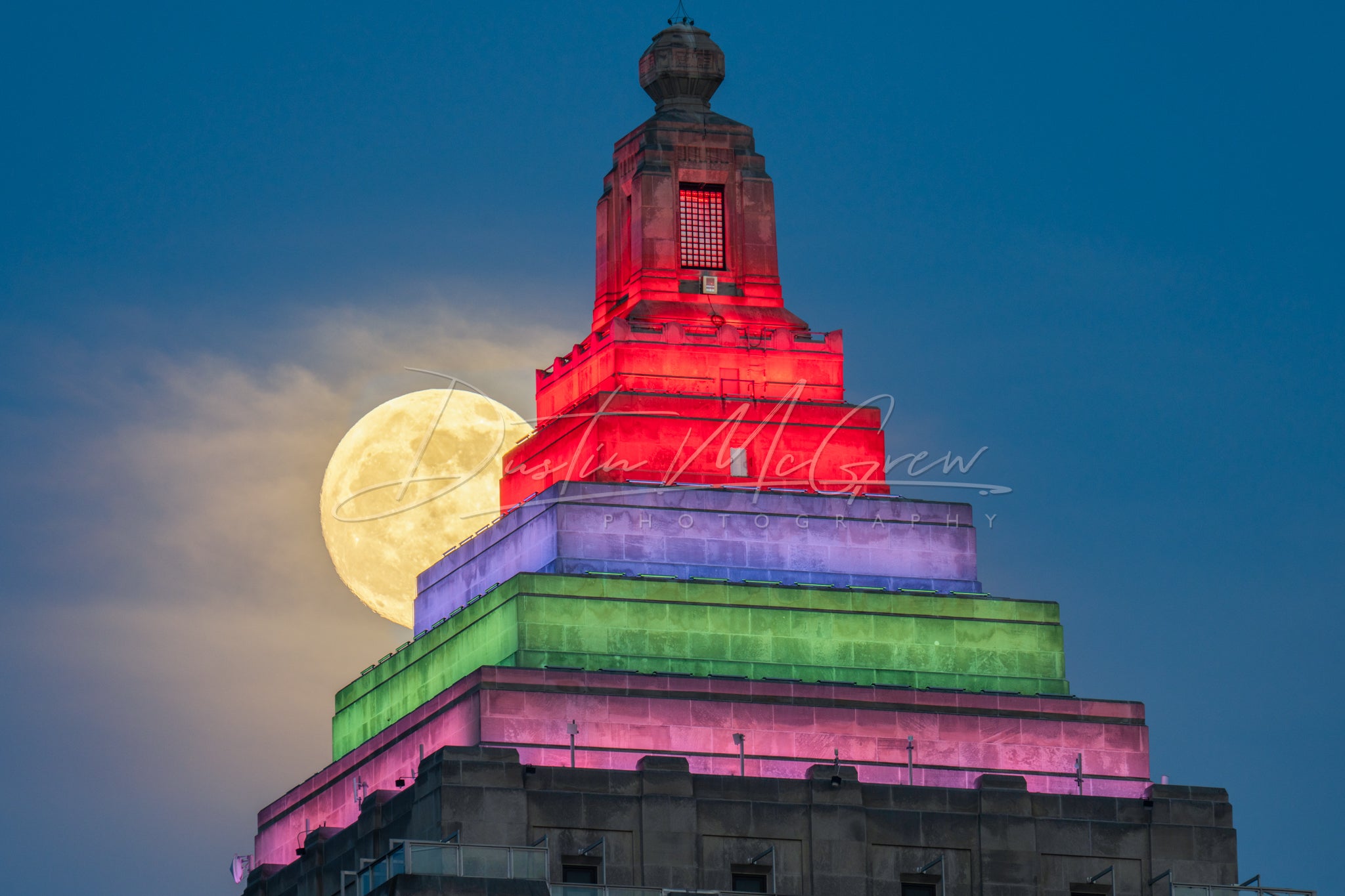 Full Moon Peeks Out From Behind the Gulf Tower
